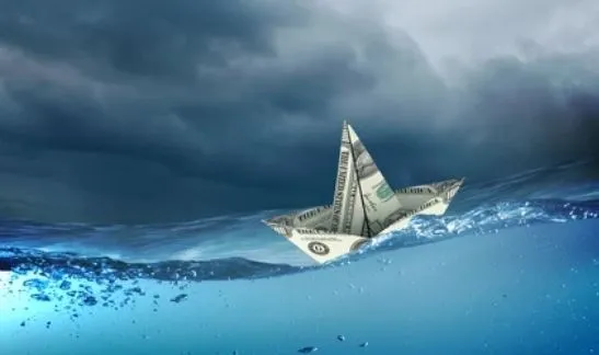 Navigating the waves of inflation. This is graphic that shows a dollar bill in the form of a ship floating in water.